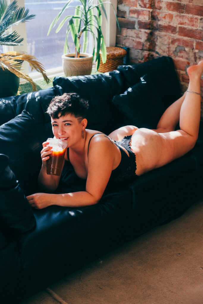 boudoir lingerie coffee cup on leather couch